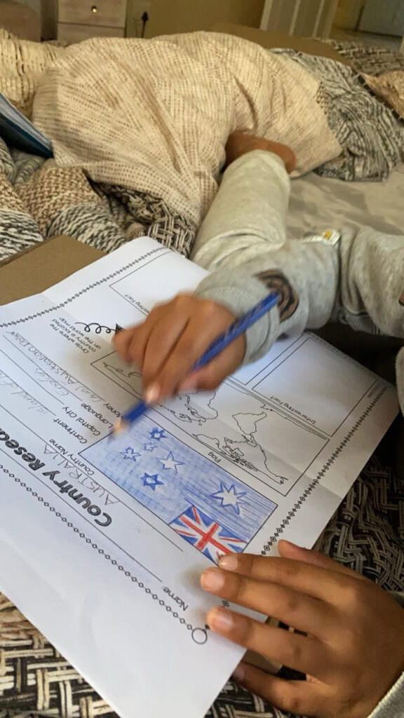 child working on his homework of Australia
