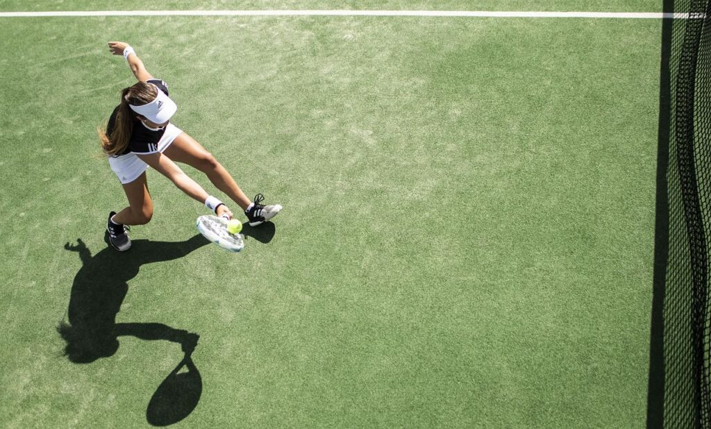 overhead shot of athlete tennis player hitting the ball
